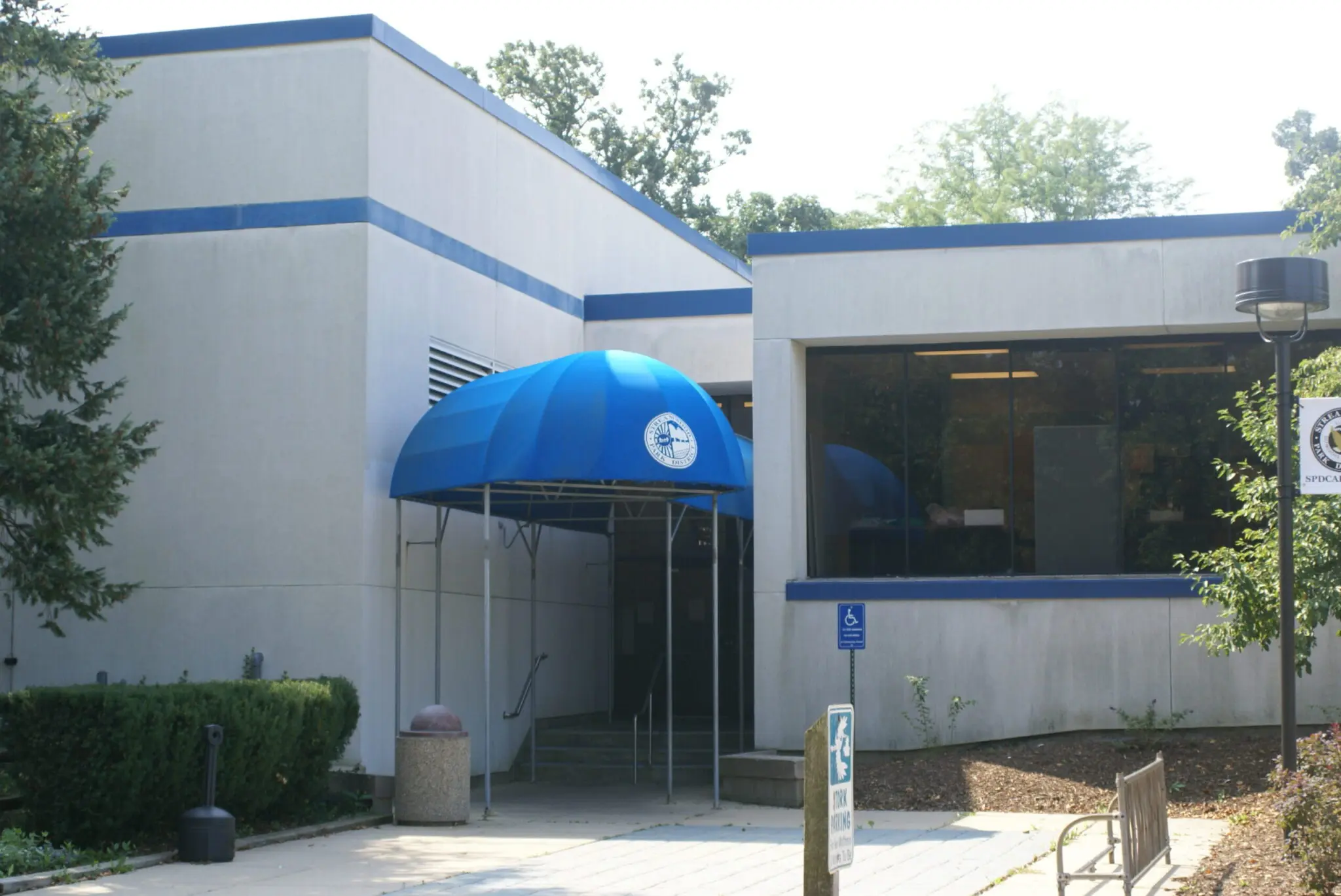 a building with a blue awning