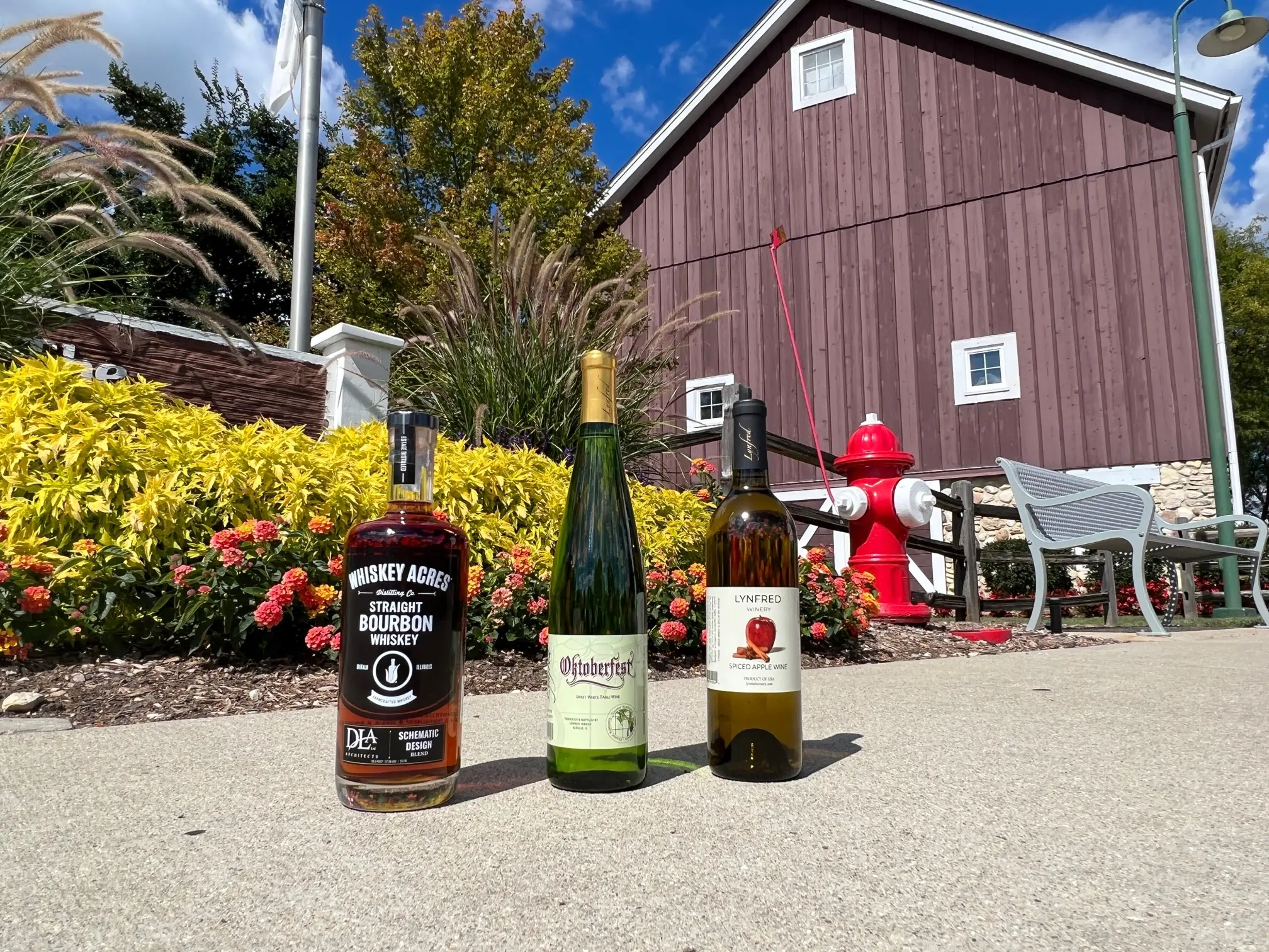bottles of alcohol on a sidewalk in front of a building