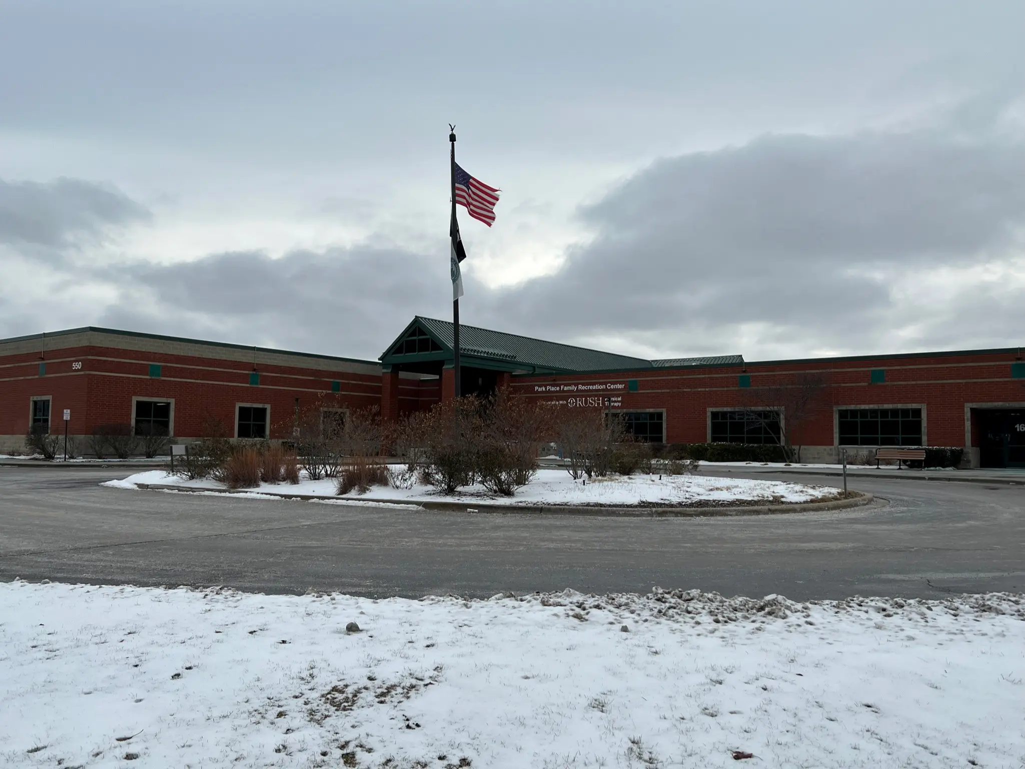 a building with a flag on the pole