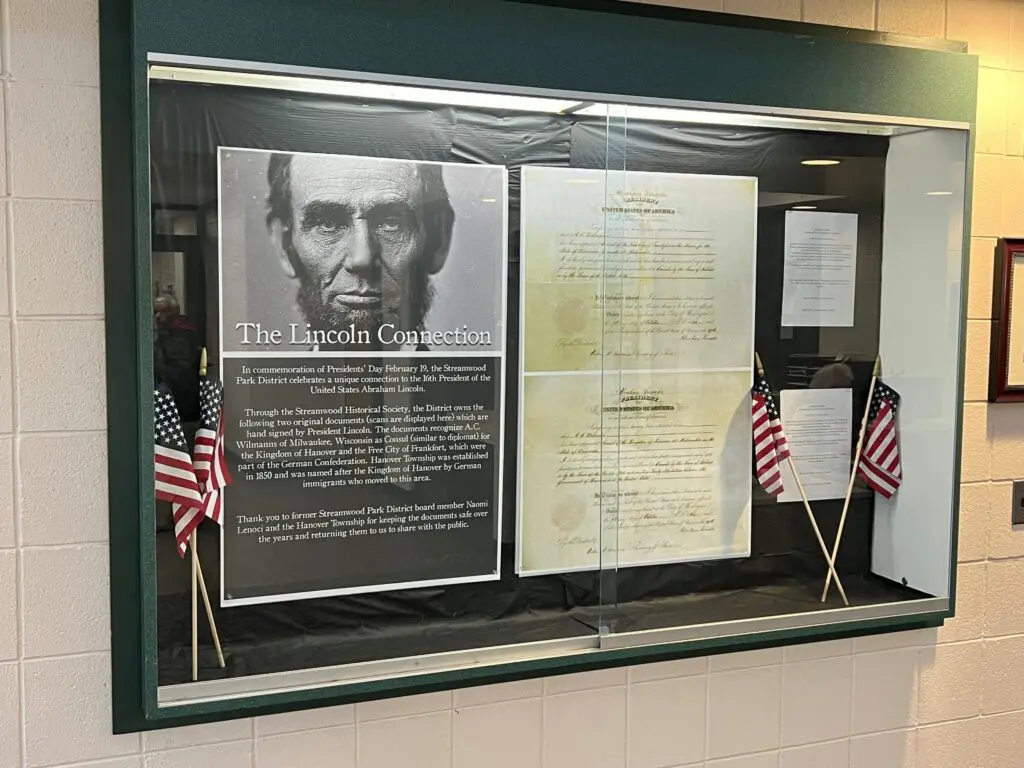 a display window with a sign and flags