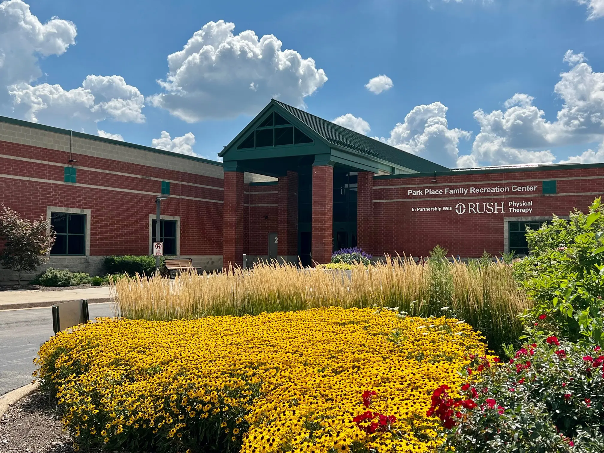 a building with flowers and a garden