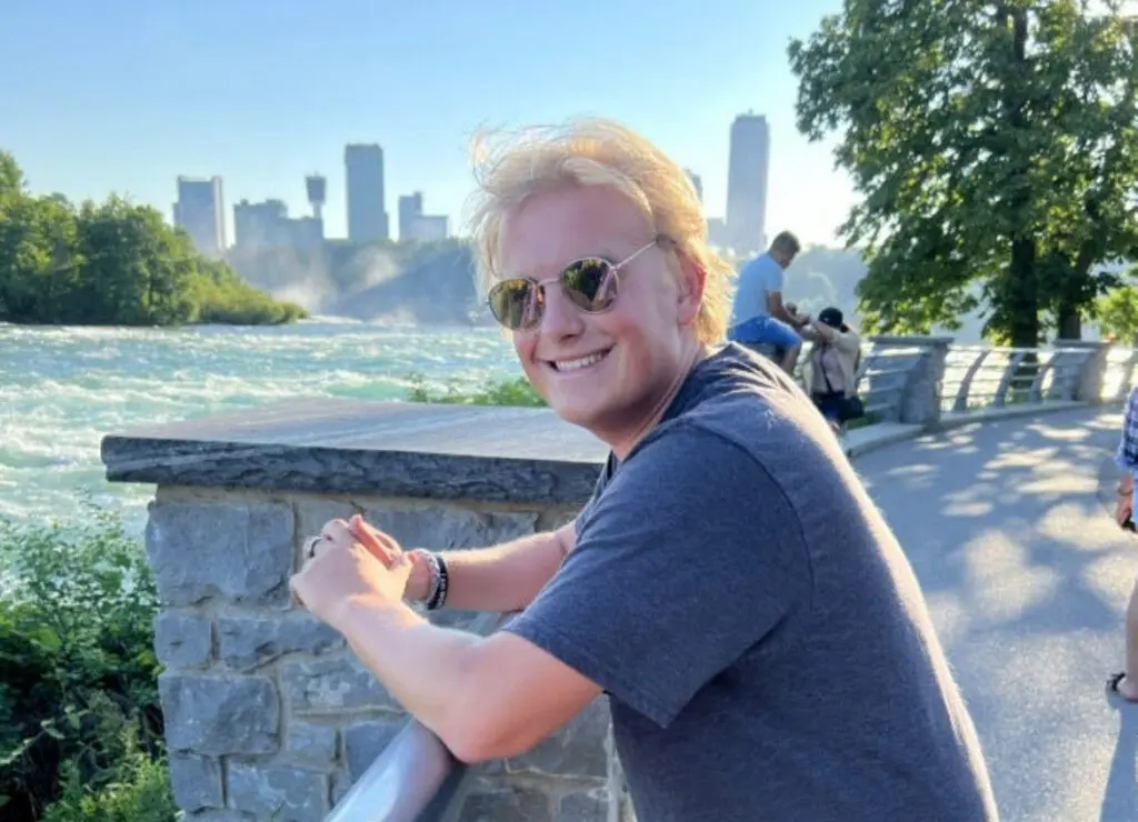 a person leaning on a railing