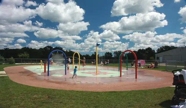 a group of kids playing in a water park