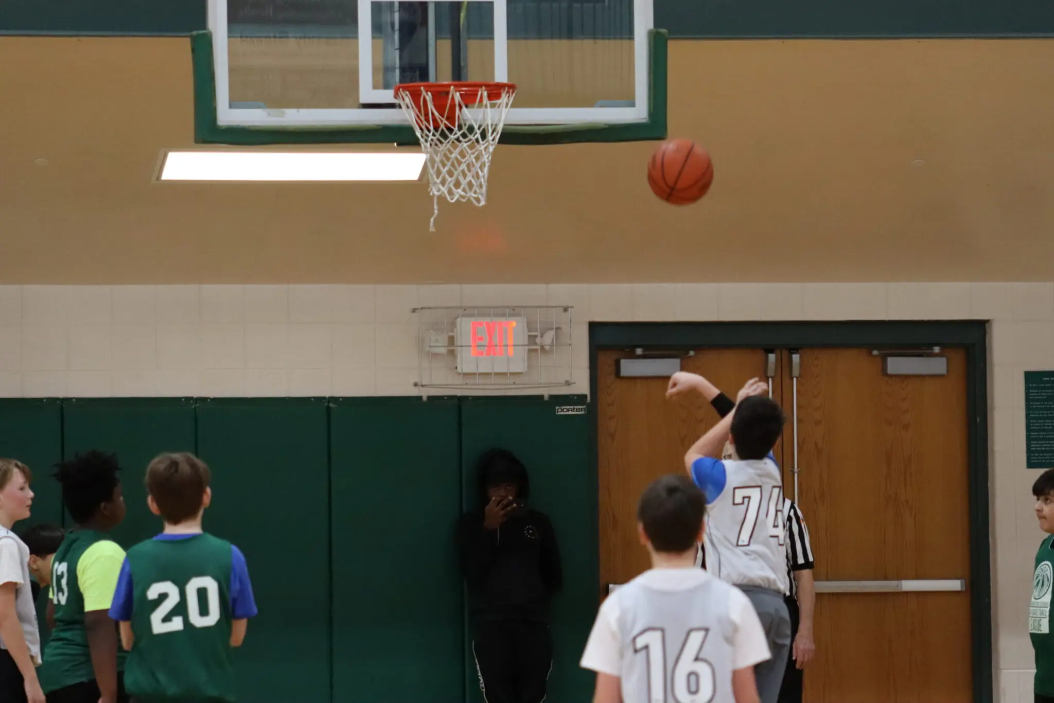 a group of people playing basketball