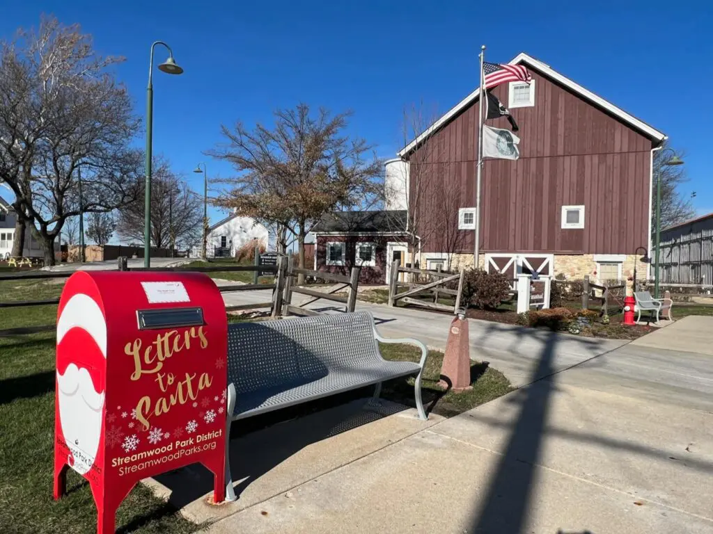 a mailbox and a mailbox in front of a barn