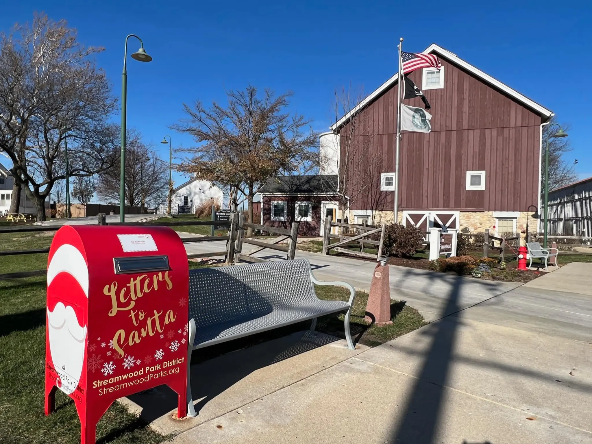 a mailbox and a mailbox in front of a barn