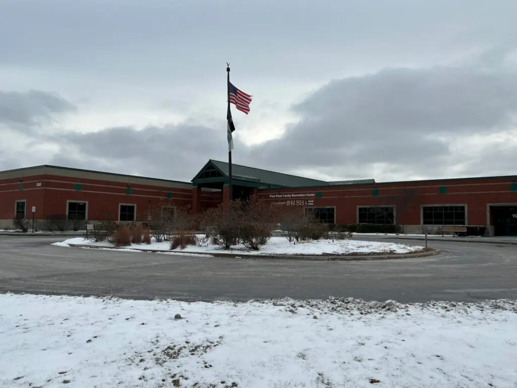 a building with a flag on the pole