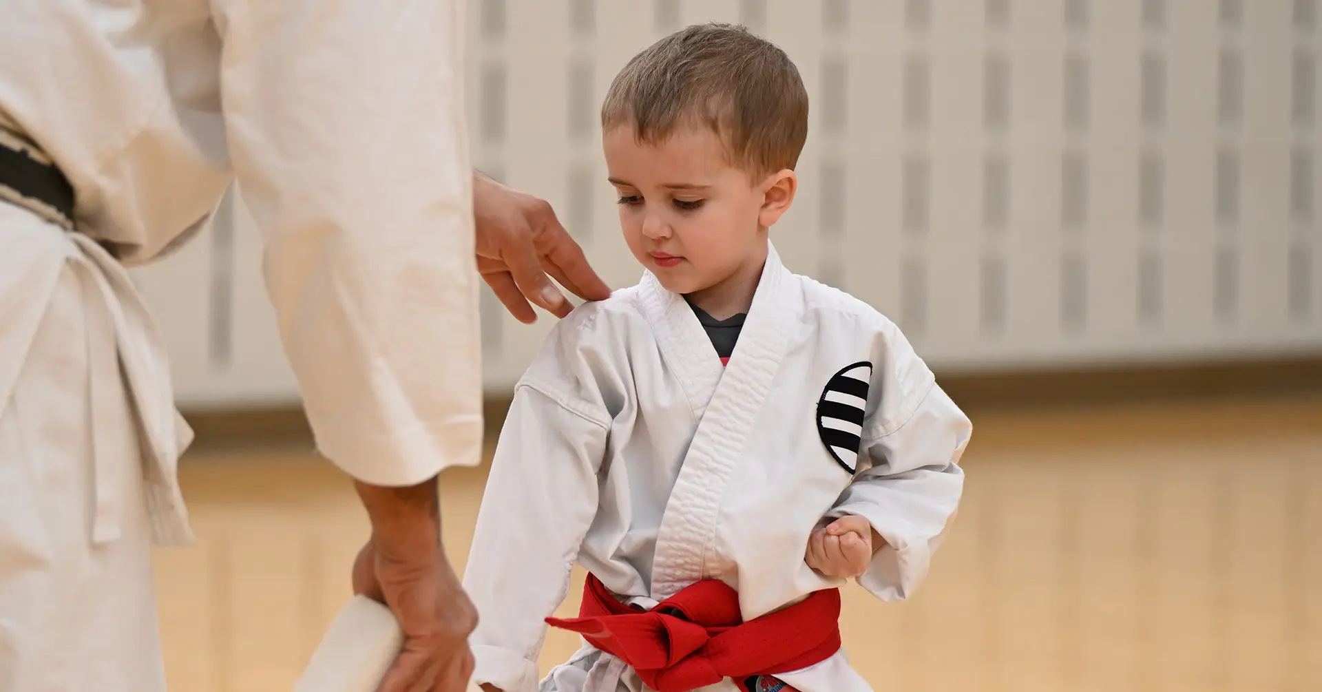 a child in a karate uniform