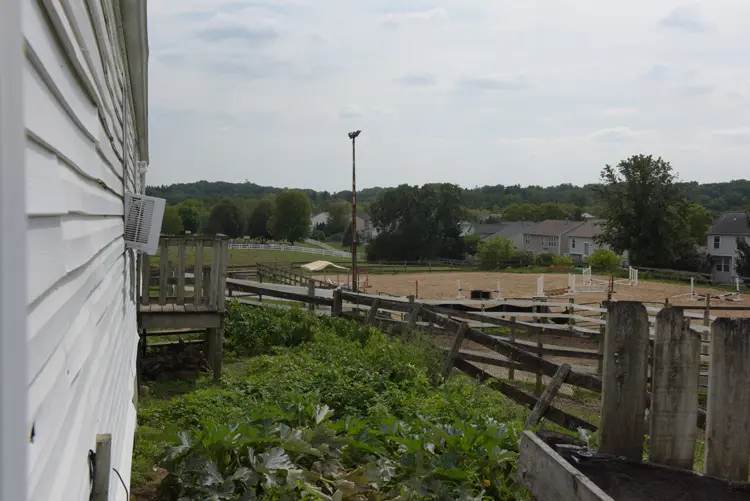 a fenced in area with a fence and a field