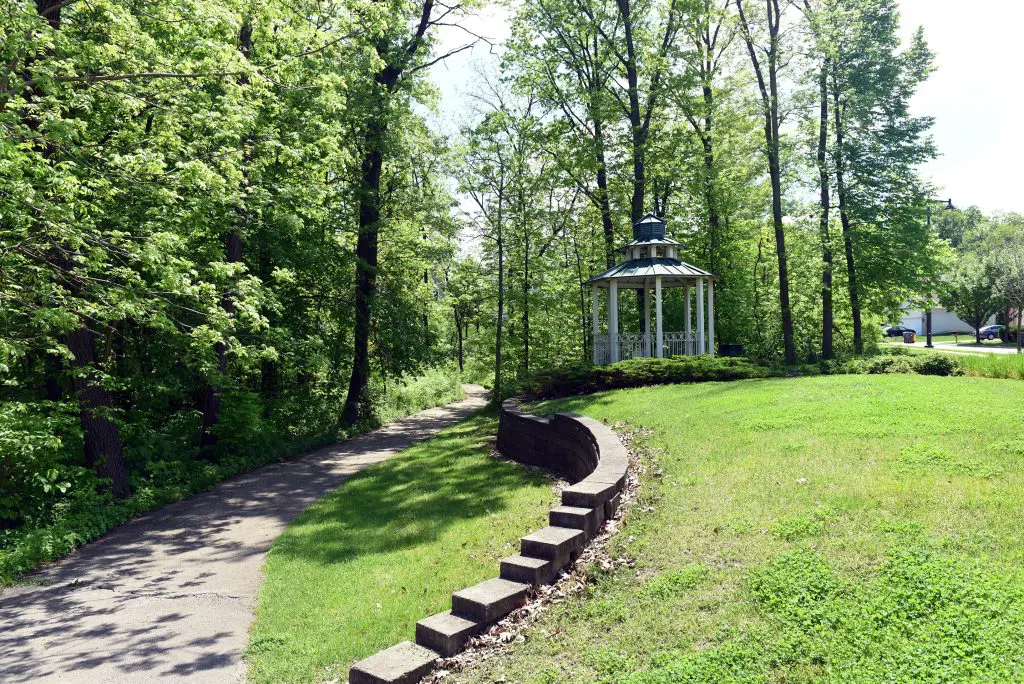 a path in a park with a gazebo