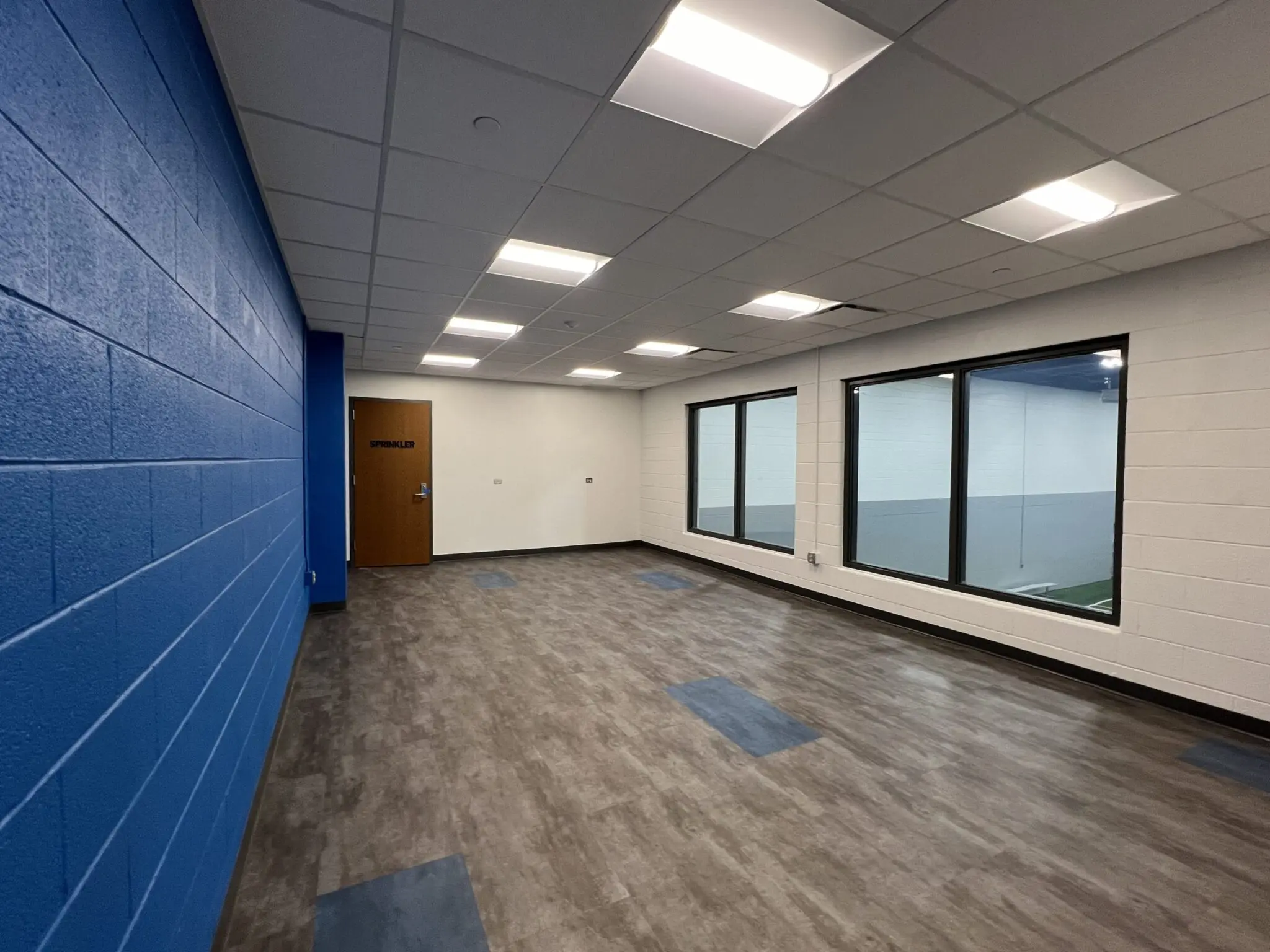 a room with a door and windows
