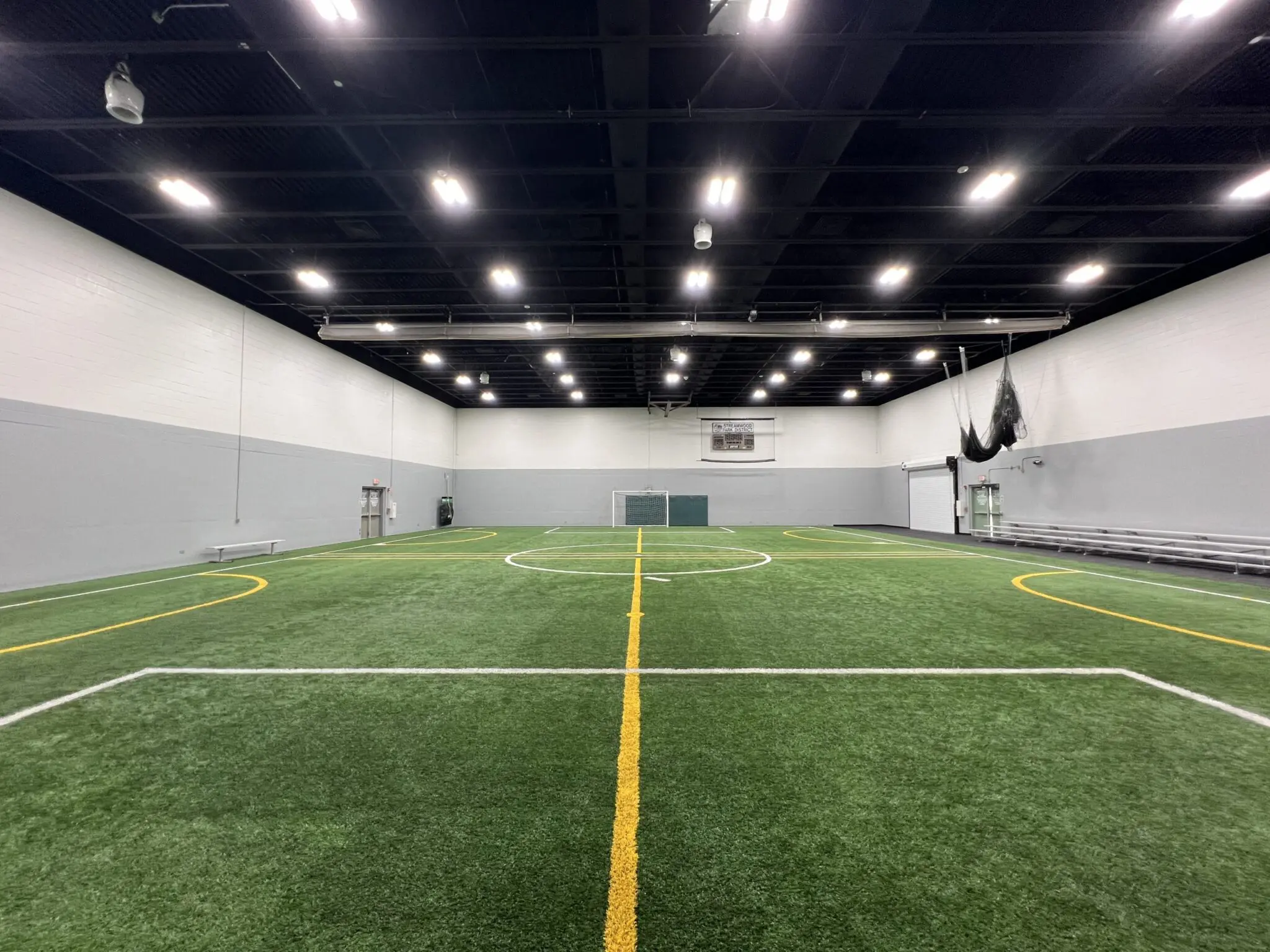 a indoor football field with a white line