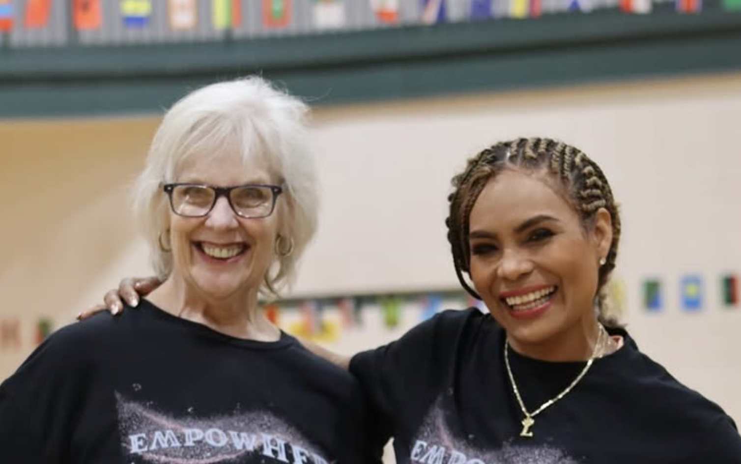 two women smiling at the camera