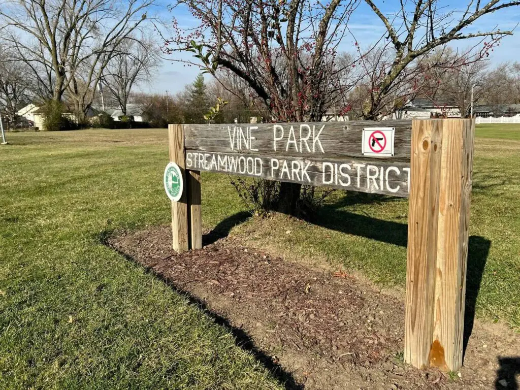 a sign in a park