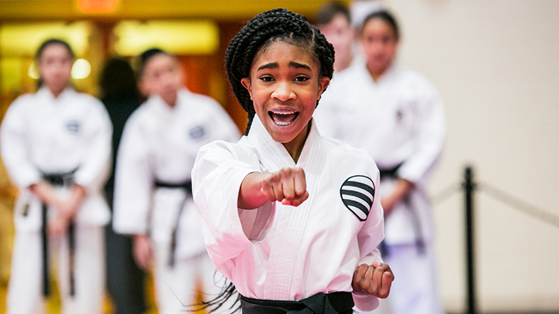 a child in a karate uniform