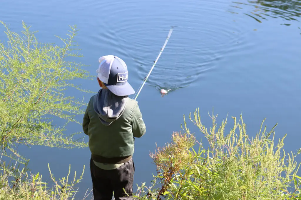 a child fishing in the water