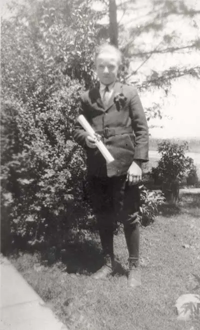 a child holding a paper and a knife