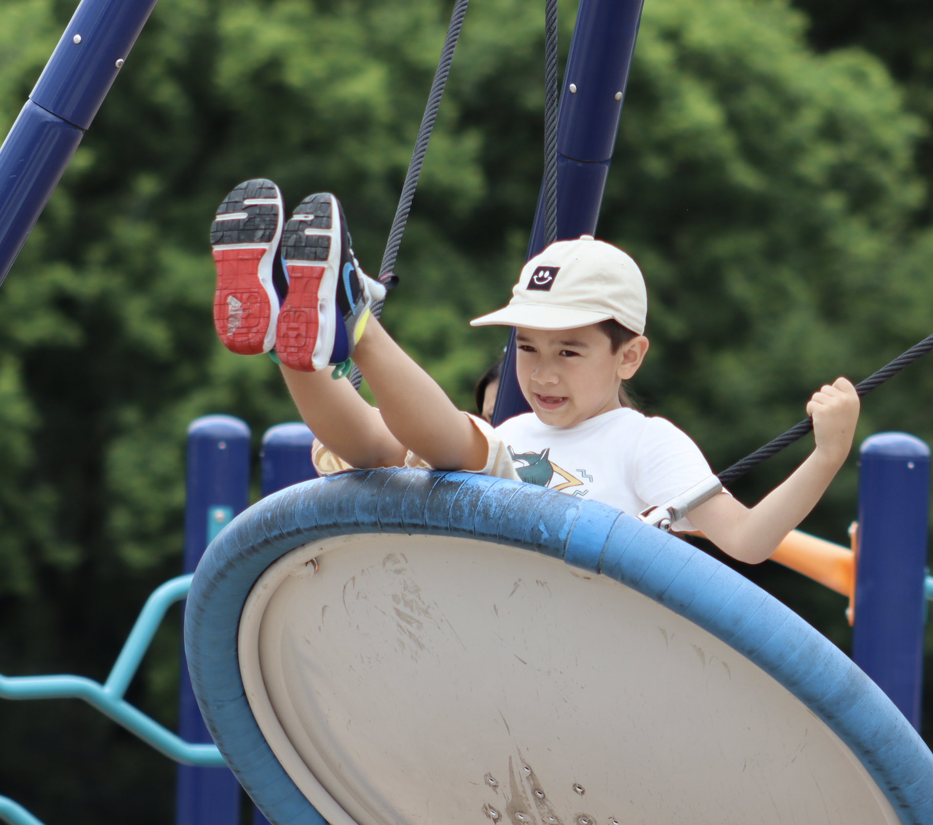 Kid on playground swing