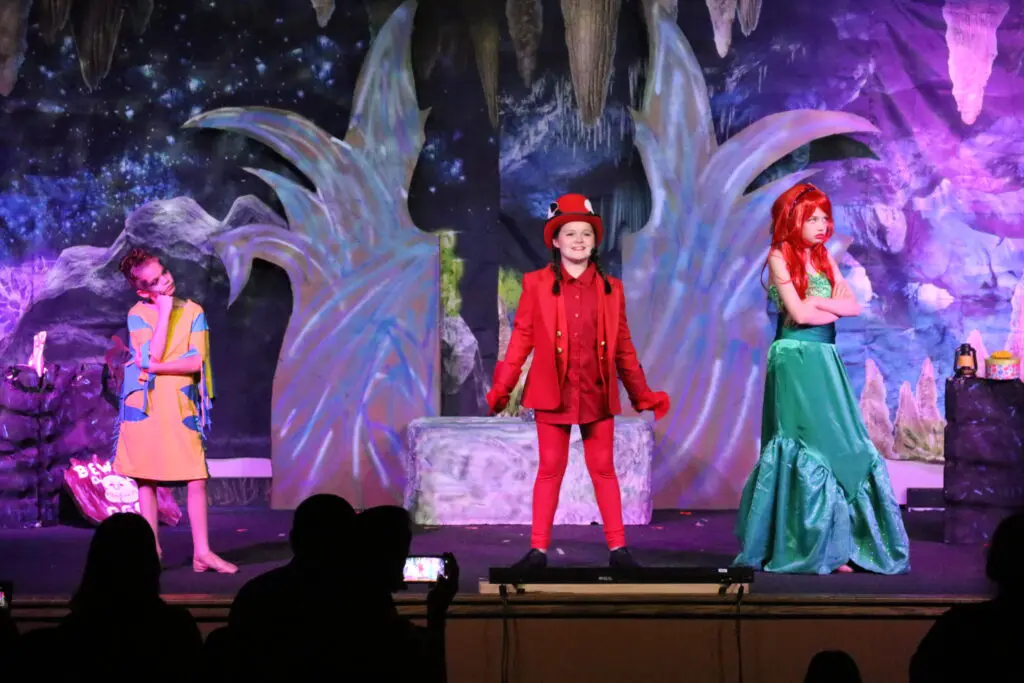 a group of kids on a stage