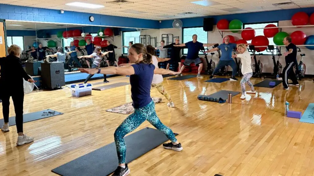 a group of people in a gym