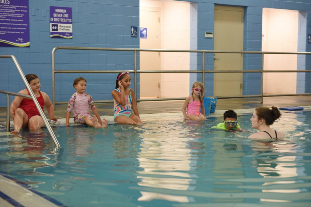 a group of kids in a pool