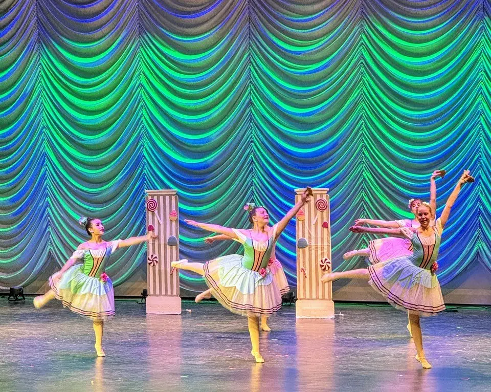 a group of women dancing on stage