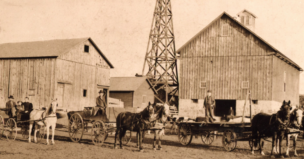 a horse drawn carriage with people on it
