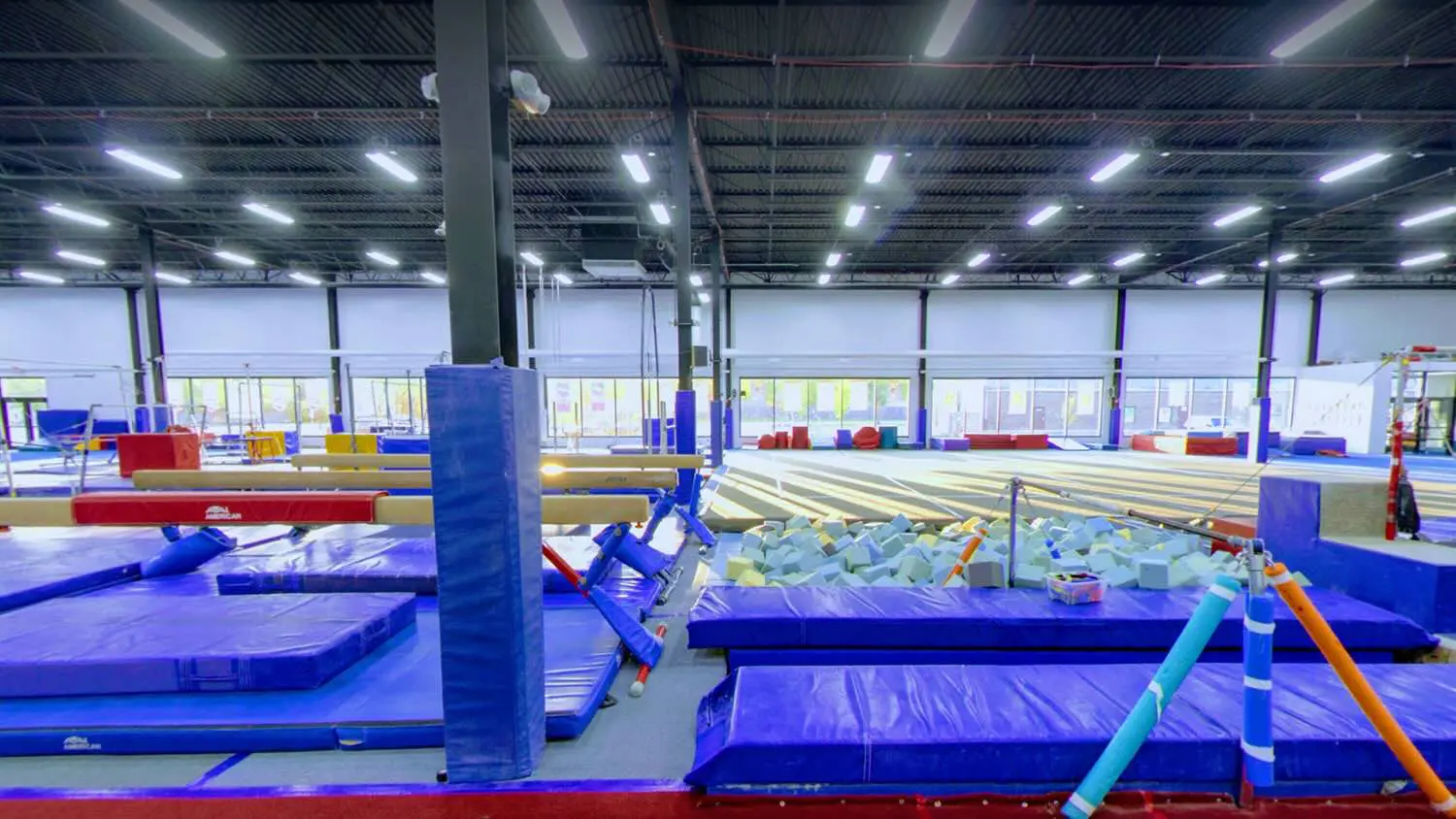 a gym with mats and blocks