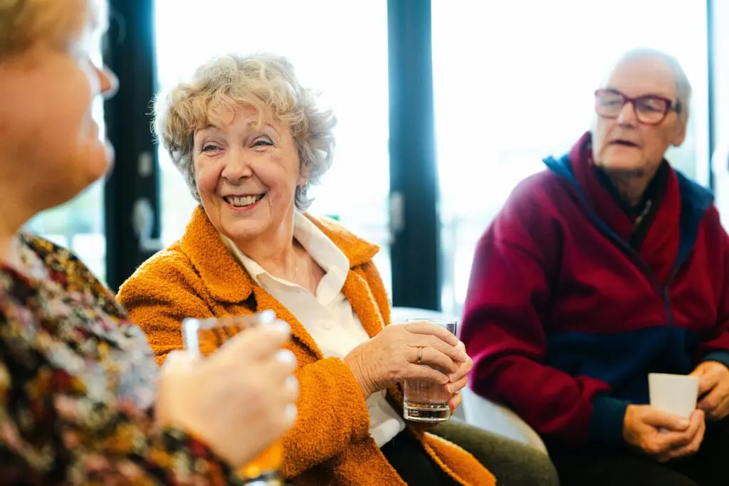 a group of people sitting and smiling
