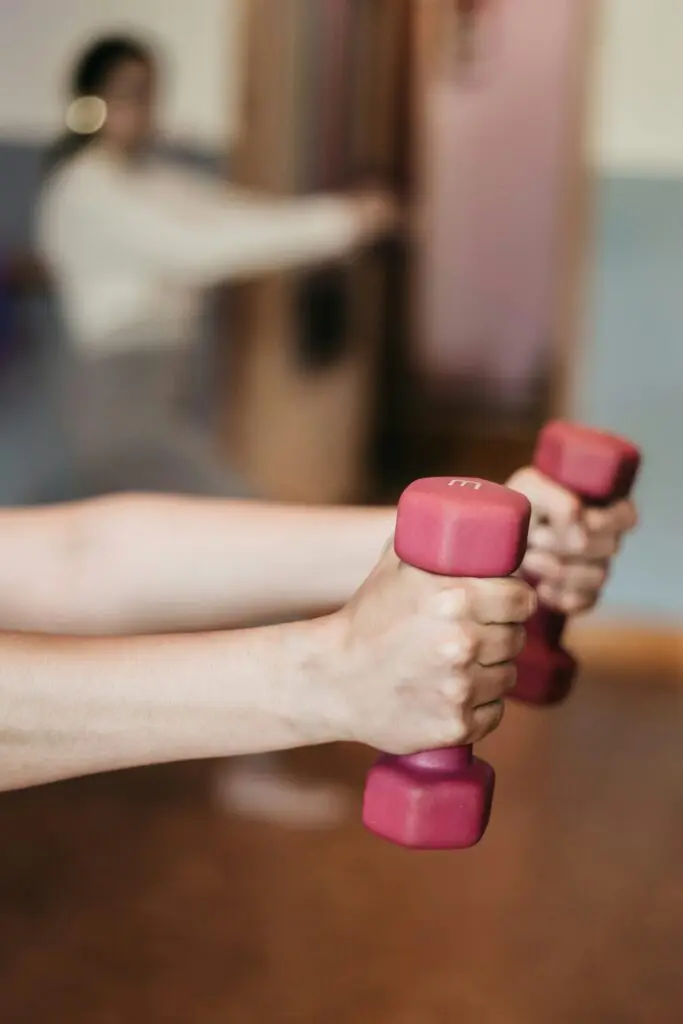 a person holding weights in their hands