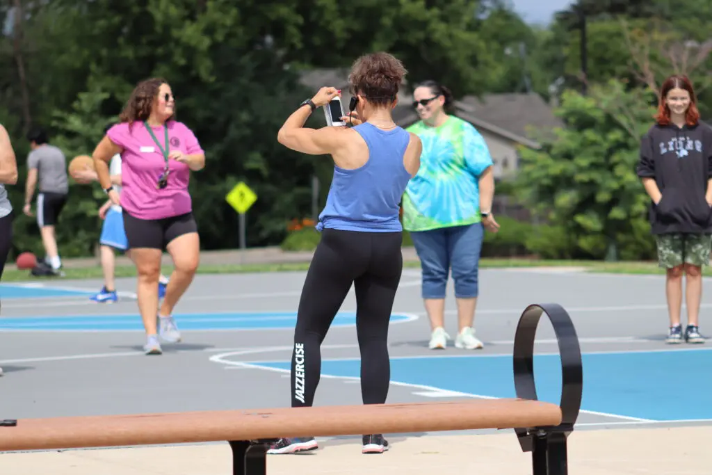 a person taking a picture of a basketball court