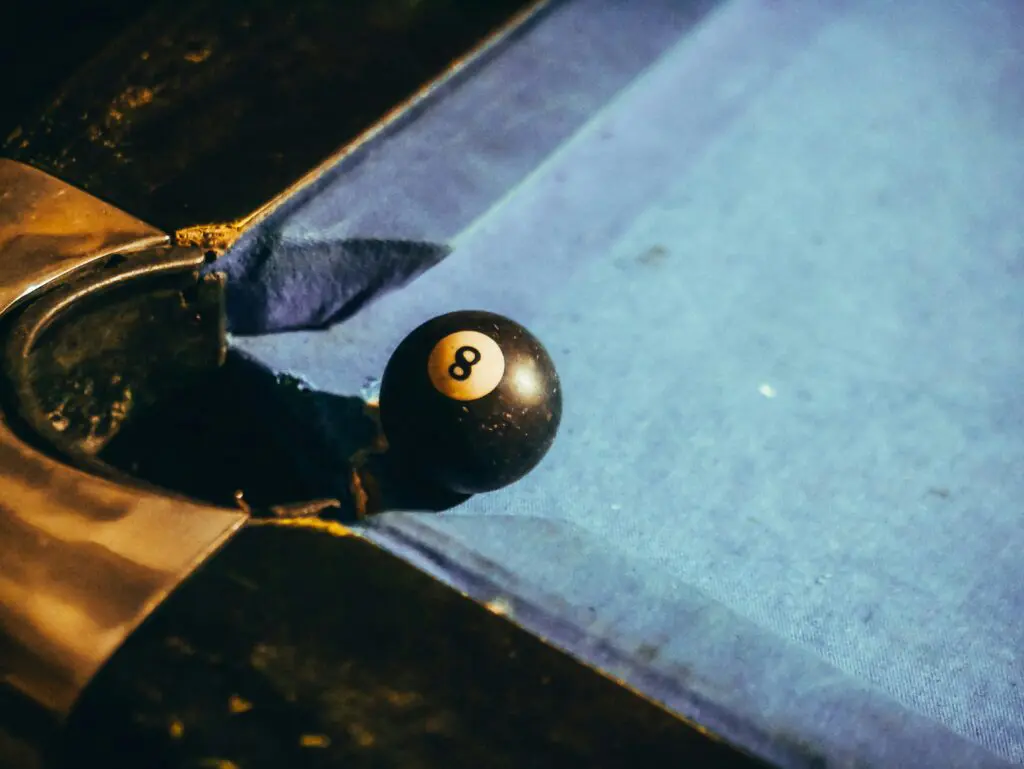 a pool ball on a blue table
